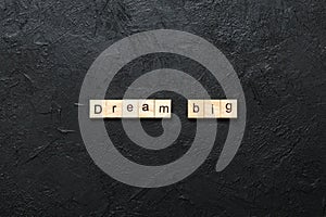 Dream big word written on wood block. Dream big text on cement table for your desing, Top view concept