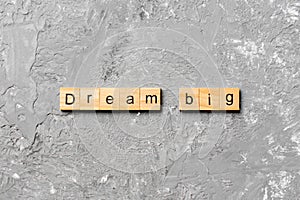 Dream big word written on wood block. Dream big text on cement table for your desing, Top view concept