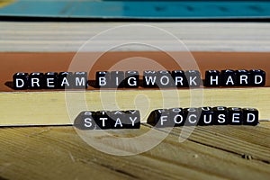 Dream big work hard stay focused on wooden blocks. Motivation and inspiration concept