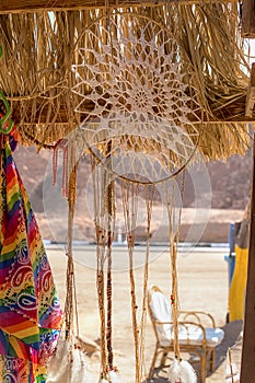 A dream catcher against the backdrop of the desert and mountains in Egypt