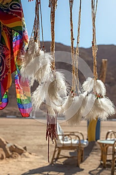 A dream catcher against the backdrop of the desert and mountains in Egypt