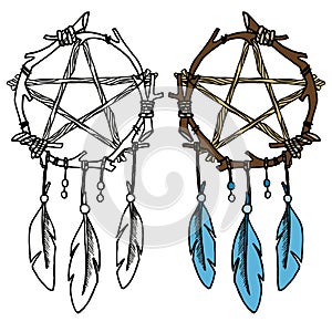 Dream catcher from branches with blue feathers and beads.