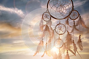 Dream catcher at sunset background