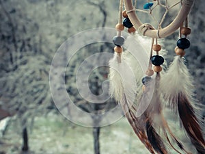 Dream catcher on a winter forest
