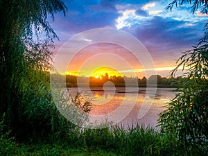 Dream fantasy landscape view of danube delta and blue colored dramatic sky at sunset