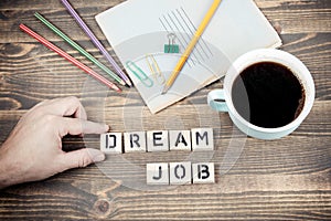 Dream Job. Wooden letters on the office desk