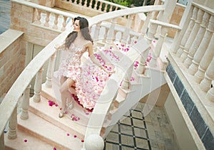 Dream wedding, beautiful bride, walking down stairs with flowers