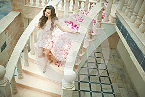 Dream wedding, beautiful bride, walking down stairs with flowers
