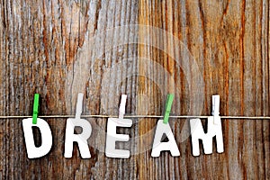 Dream word on wooden background