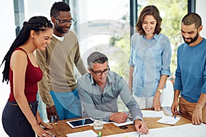 The dream works with teamwork. a group of architects in the boardroom.