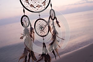 Dreamcatcher, on sea background, magical indian shaman amulet, mystical. Boho