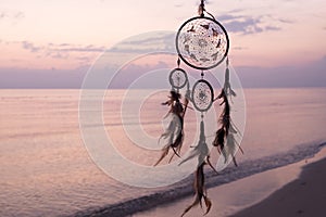 Dreamcatcher, on sea background, magical indian shaman amulet, mystical. Boho