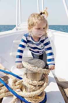 Dreamer kid in striped marine shirt. small sailor on boat. let dream come true. summer vacation. child dream to be