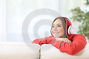 Dreamer teen girl listening music photo