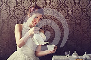 Dreamer woman drinking tea at tea time photo