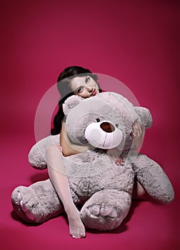 Dreaminess. Sentimental Girl with Soft Toy - Gray Bruin in Embrace