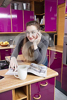 dreaming beautiful young woman looking away for kitchen deco imagination