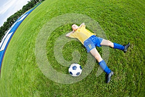 Dreaming boy soccer player