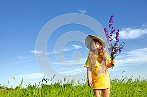 Dreaming girl in the grass