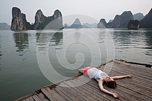 Dreaming girl on the pier