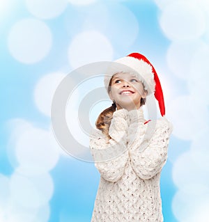 Dreaming girl in santa helper hat