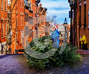 Dreaming image of a boy sit, pretend to fly on Christmas tree