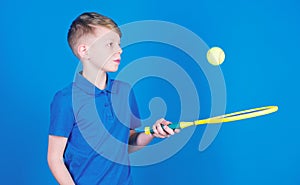 Dreaming about sport career. Athlete kid tennis racket on blue background. Tennis sport and entertainment. Boy child