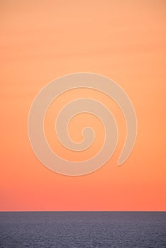 Dreaming sunset on the sea. pale orange gradient sky background