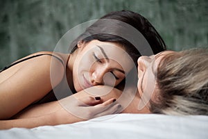 Dreaming woman enjoying romantic moment lying on man shoulder