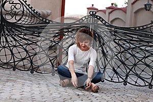 Dreaming woman sitting down outside