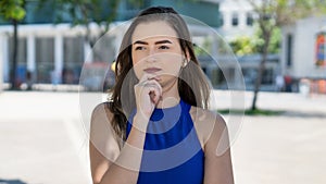 Dreaming young caucasian woman with brunette hair