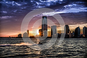 A Dreamlike Sunset over the Waters of Hudson River with Jersey City Skyline on the Horizon - Manhattan, New York City