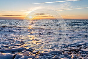 dreamlike, sunset between rocks in the sea of the Baltic Sea on the island of Rügen