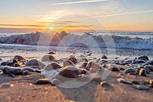 dreamlike, sunset between rocks in the sea of the Baltic Sea on the island of Rügen