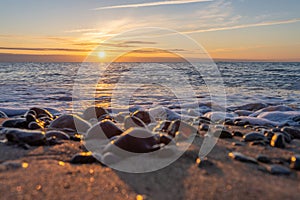 dreamlike, sunset between rocks in the sea of the Baltic Sea on the island of Rügen