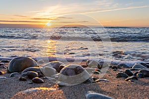 dreamlike, sunset between rocks in the sea of the Baltic Sea on the island of Rügen