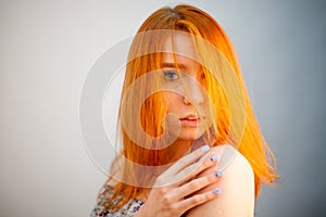 Dreammy portrait of happy redhead woman in soft focus