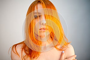 Dreammy portrait of happy redhead woman in soft focus