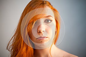 Dreammy portrait of redhead woman in soft focus