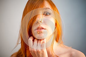 Dreammy portrait of redhead woman in soft focus