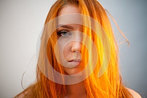 Dreammy portrait of redhead woman in soft focus