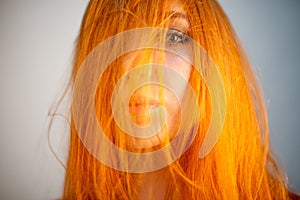 Dreammy portrait of shy redhead woman in soft focus