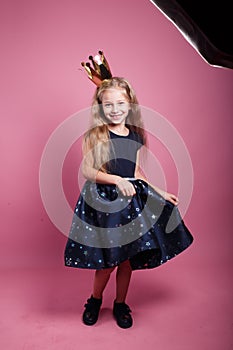 Dreams about being princess comes true,cute smiling little girl in princess dress