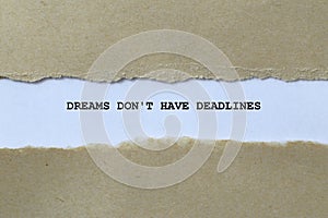 dreams don\'t have deadlines on white paper photo