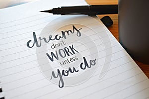 DREAMS DON`T WORK UNLESS YOU DO hand-lettered in notebook