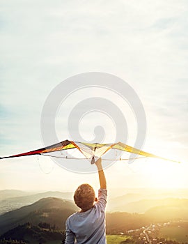 In dreams about flying. Boy takes a kite over his head