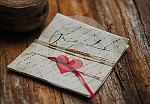 Heartfelt Friendship: Letter with Red Paper Heart photo