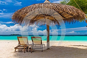 Dreamy beach with sun loungers