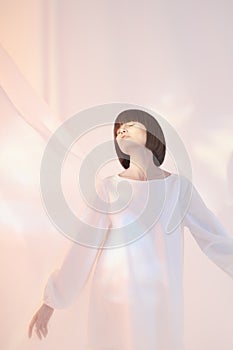 Dreamy brunette in white dress