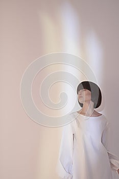 Dreamy brunette in white dress